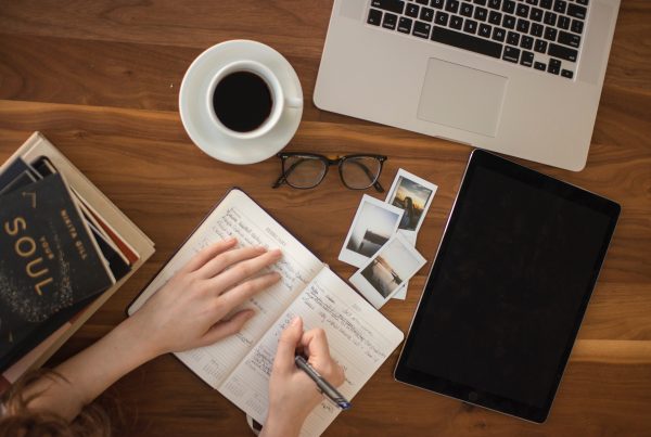 someones-hand-writing-internal-and-external-employer-branding-strategy